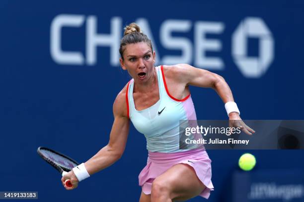 Simona Halep of Romania plays a forehand against Daria Snigur of Ukraine during the Women's Singles First Round on Day One of the 2022 US Open at...