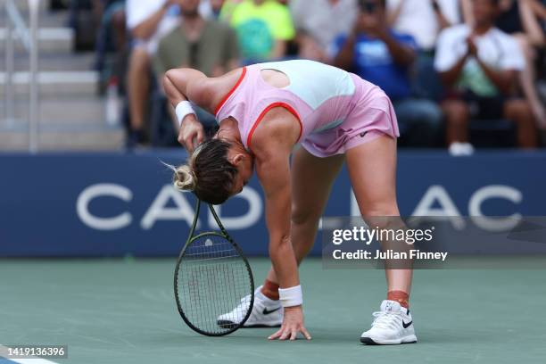 Simona Halep of Romania reacts against Daria Snigur of Ukraine during the Women's Singles First Round on Day One of the 2022 US Open at USTA Billie...