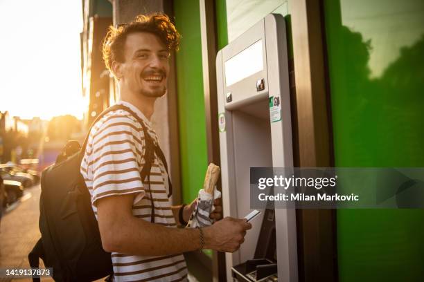 i will check my account balance - man reading card stock pictures, royalty-free photos & images