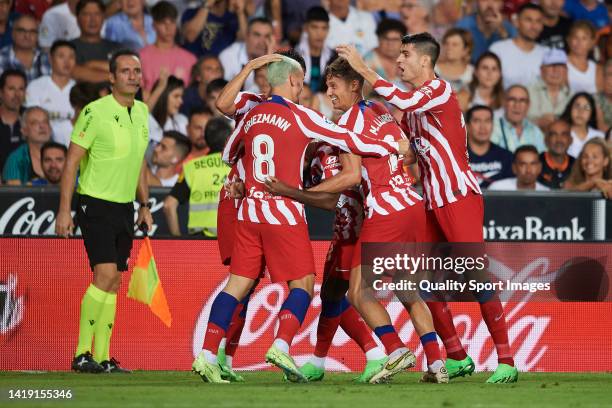 Antoine Griezmann of Atletico de Madrid celebrates after scoring his team's first goal during the LaLiga Santander match between Valencia CF and...