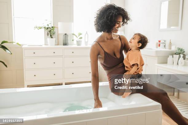 home pamper routine with baby - beautiful baby bildbanksfoton och bilder