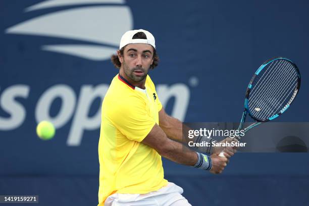 Jordan Thompson of Australia returns a shot against Lorenzo Sonego of Italy during the Men's Singles First Round on Day One of the 2022 US Open at...