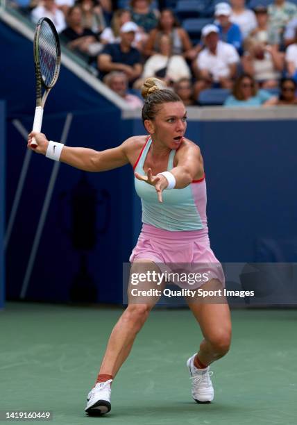 Simona Halep of Romania looks to return a ball against Daria Snigur of Ukraine during the Women's Singles First Round on Day One of the 2022 US Open...