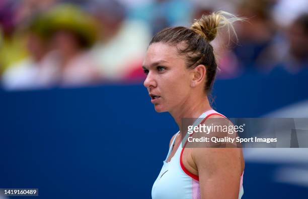 Simona Halep of Romania looks on against Daria Snigur of Ukraine during the Women's Singles First Round on Day One of the 2022 US Open at USTA Billie...