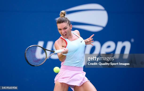 Simona Halep of Romania plays a forehand shot against Daria Snigur of Ukraine during the Women's Singles First Round on Day One of the 2022 US Open...