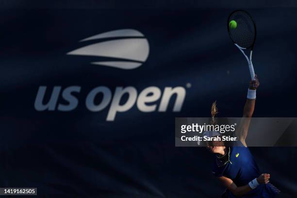 Jil Teichmann of Switzerland serves against Shuai Zhang of China during the Women's Singles First Round on Day One of the 2022 US Open at USTA Billie...