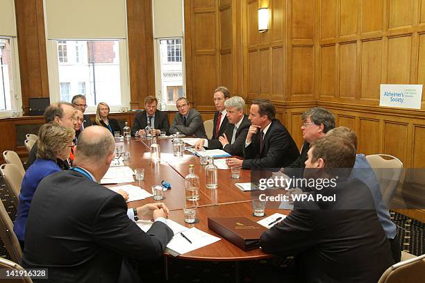 Health Secretary Andrew Lansley and Prime Minister David Cameron during a meeting with members of the Alzheimer's Society after it was announced that...