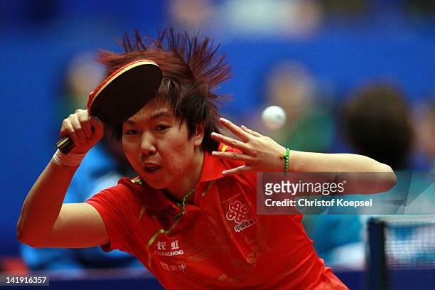 Li Xiaoxia of China plays a forehand during her match against Tetyana Bilenko of Ukraine during the LIEBHERR table tennis team world cup 2012...