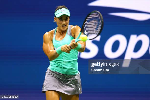 Danka Kovinic of Montenegro plays a backhand against Serena Williams of the United States during the Women's Singles First Round on Day One of the...