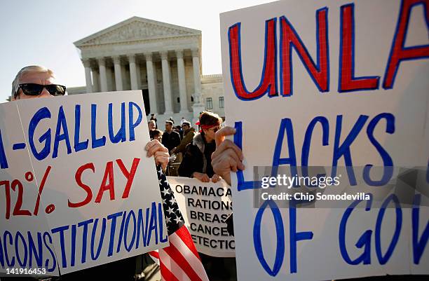 Demonstrators for and against the Patient Protection and Affordable Care Act march and chant in outside the U.S. Supreme Court Building on March 26,...