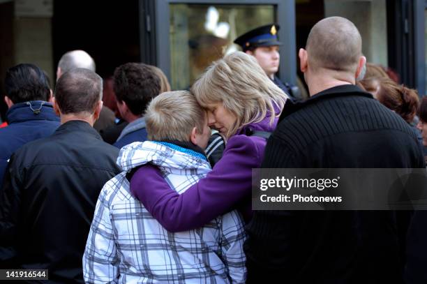 Members of the public outside the Soeverein Arena during the funeral ceremony for those who died in the Sierre Bus Crash on March 22, 2012 in...