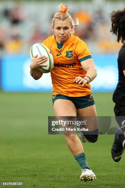 Georgina Friedrichs of the Wallaroos make s a break during the O'Reilly Cup match between the Australian Wallaroos and the New Zealand Black Ferns at...