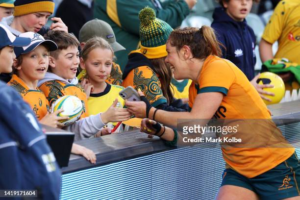 Emily Chancellor of the Wallaroos signs autographs after the O'Reilly Cup match between the Australian Wallaroos and the New Zealand Black Ferns at...