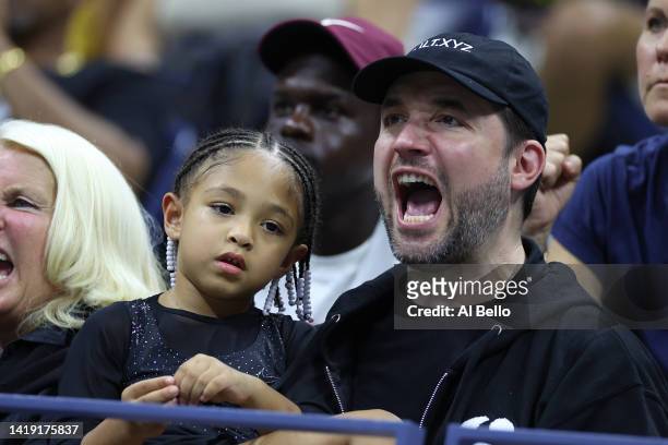 Alexis Ohanian and Alexis Olympia Ohanian Jr., husband and daughter of Serena Williams of the United States, react after Serena's win against Danka...