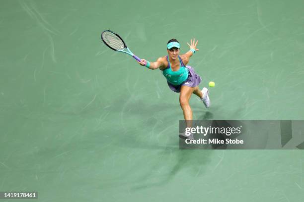 Danka Kovinic of Montenegro returns a shot against Serena Williams of the United States during the Women's Singles First Round on Day One of the 2022...