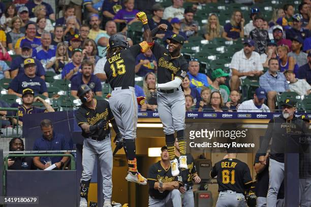 Oneil Cruz of the Pittsburgh Pirates is congratulated by Rodolfo Castro following a three run home run against the Milwaukee Brewers during the fifth...