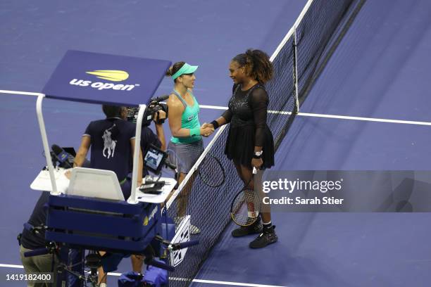 Serena Williams of the United States shakes hands with Danka Kovinic of Montenegro after her win during the Women's Singles First Round on Day One of...