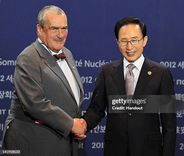 In this handout image provided by Yonhap News, Czech Foreign Minister Karel Schwarzenberg and South Korean President Lee Myung-bak pose at the...