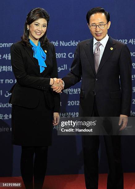 In this handout image provided by Yonhap News, Thai Prime Minister Yingluck Shinawatra and South Korean President Lee Myung-bak pose at the welcoming...