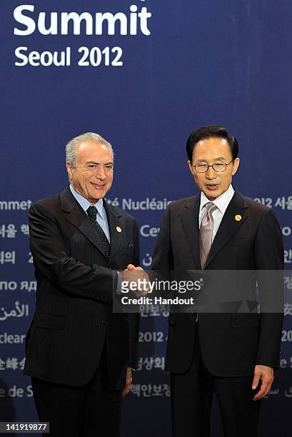 In this handout image provided by Yonhap News, Brazilian Vice President Michel Temer and South Korean President Lee Myung-bak pose at the welcoming...
