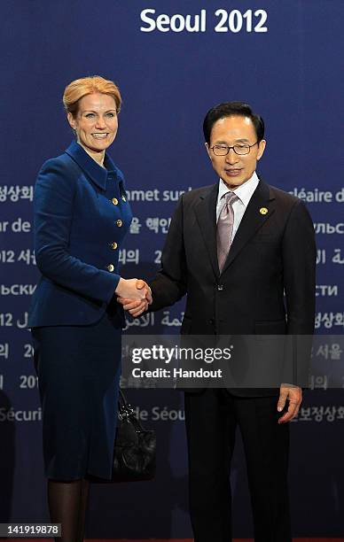 In this handout image provided by Yonhap News, Danish Prime Minister Helle Thorning-Schmidt and South Korean President Lee Myung-bak pose at the...