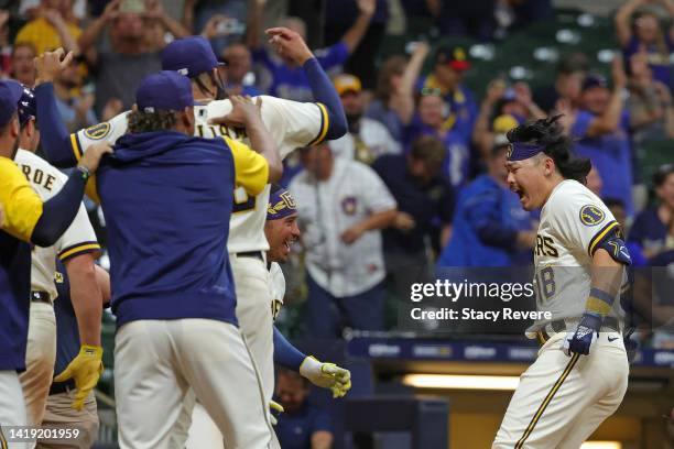 Keston Hiura of the Milwaukee Brewers is congratulated by teammates following a walk off two run home run against the Pittsburgh Pirates during the...