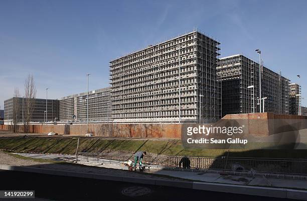 Workers finish a sidewalk next to the new headquarters of the German intelligence service, the BND , on March 26, 2012 in Berlin, Germany. Once...