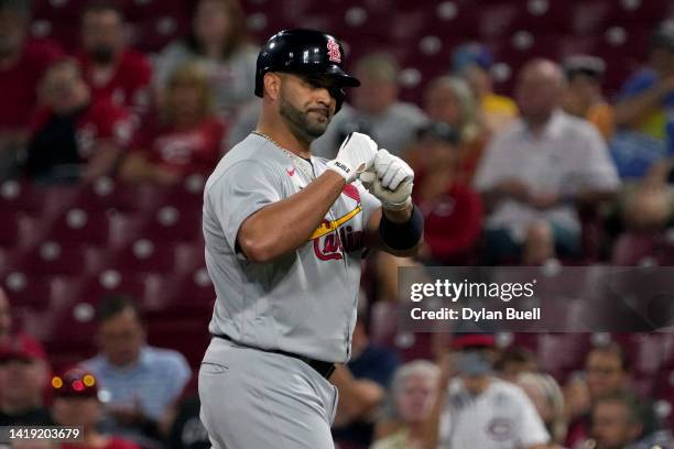 Albert Pujols of the St. Louis Cardinals celebrates after hitting a single in the second inning against the Cincinnati Reds at Great American Ball...