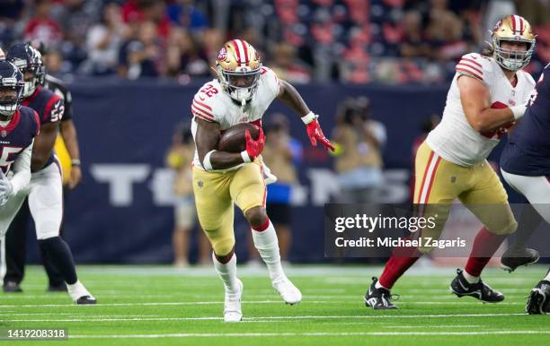 Jeff Wilson Jr. #22 of the San Francisco 49ers rushes during the game against the Houston Texans at NRG Stadium on August 25, 2022 in Minneapolis,...