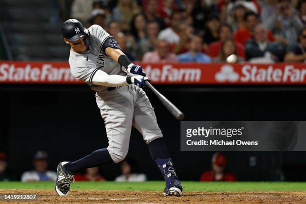 Aaron Judge of the New York Yankees hits his 50th home run of the season against the Los Angeles Angels during the eighth inning at Angel Stadium of...