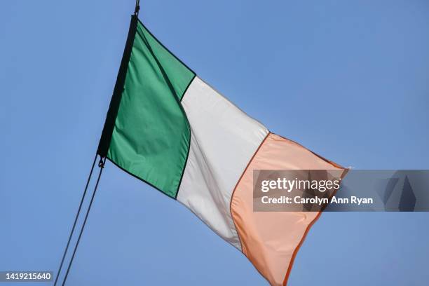 irish flag near marina - ireland flag stock pictures, royalty-free photos & images