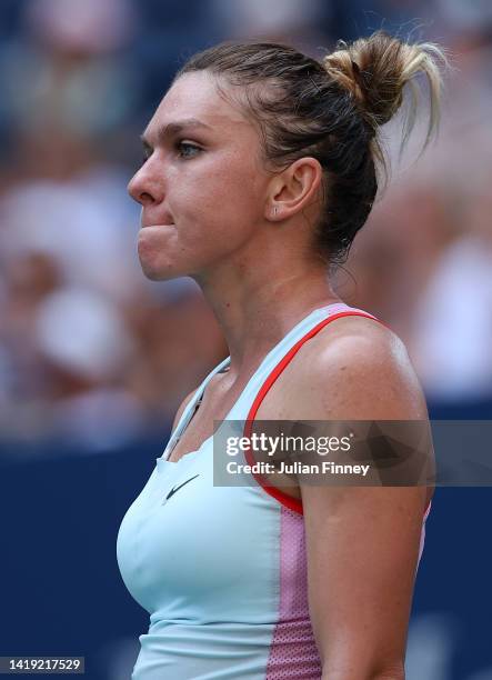 Simona Halep of Romania reacts against Daria Snigur of Ukraine during the Women's Singles First Round on Day One of the 2022 US Open at USTA Billie...