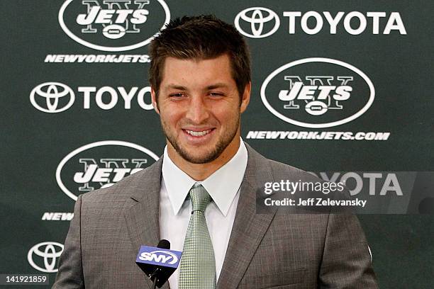 Quarterback Tim Tebow addresses the media as he is introduced as a New York Jet at the Atlantic Health Jets Training Center on March 26, 2012 in...