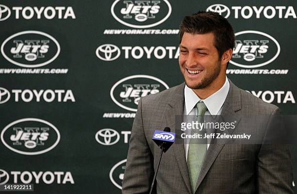Quarterback Tim Tebow addresses the media as he is introduced as a New York Jet at the Atlantic Health Jets Training Center on March 26, 2012 in...