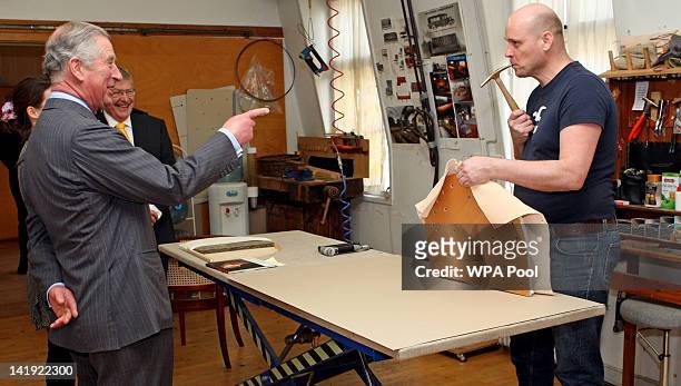Prince Charles, Prince of Wales talks to craftsman during a visit to the Rud Rasmussen furniture warehouse on March 26, 2012 in Copenhagen, Denmark....