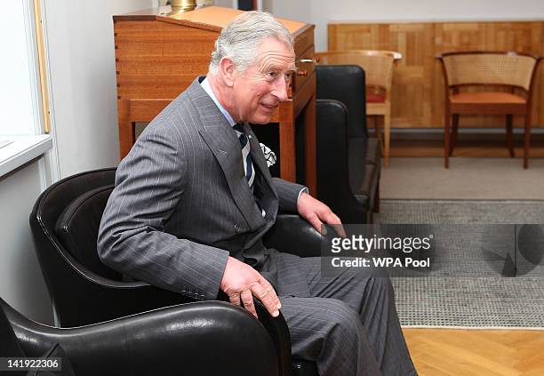Prince Charles, Prince of Wales tries out a chair during a visit to the Rud Rasmussen furniture warehouse on March 26, 2012 in Copenhagen, Denmark....