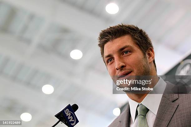 Quarterback Tim Tebow addresses the media as he is introduced as a New York Jet at the Atlantic Health Jets Training Center on March 26, 2012 in...