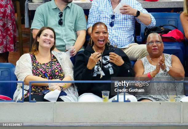 Queen Latifah cheers during the Women's Singles First Round match between Serena Williams of the United States and Danka Kovinic of Montenegro on Day...