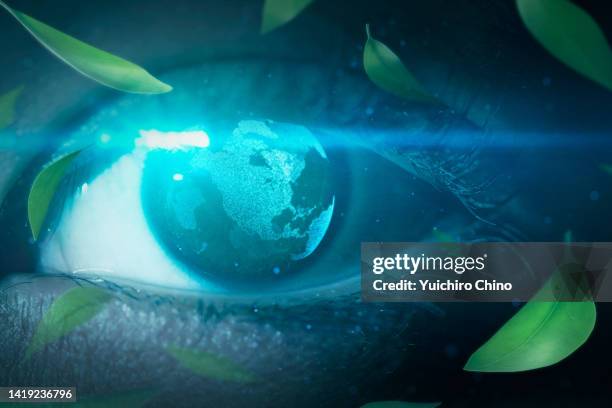 green eye with earth and leaves. - climate change health stock pictures, royalty-free photos & images