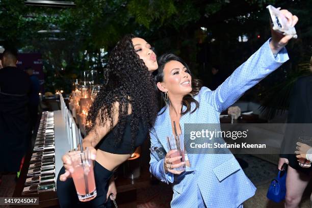 Samantha Logan and Janel Parrish attend Patrick Ta Beauty's Major Skin Launch at The West Hollywood EDITION on August 29, 2022 in West Hollywood,...