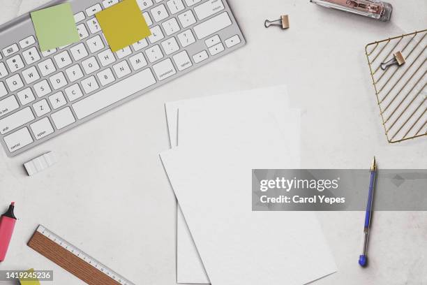 office table top  view with office supplies, blank papers, eyeglasses...template - office work flat lay foto e immagini stock