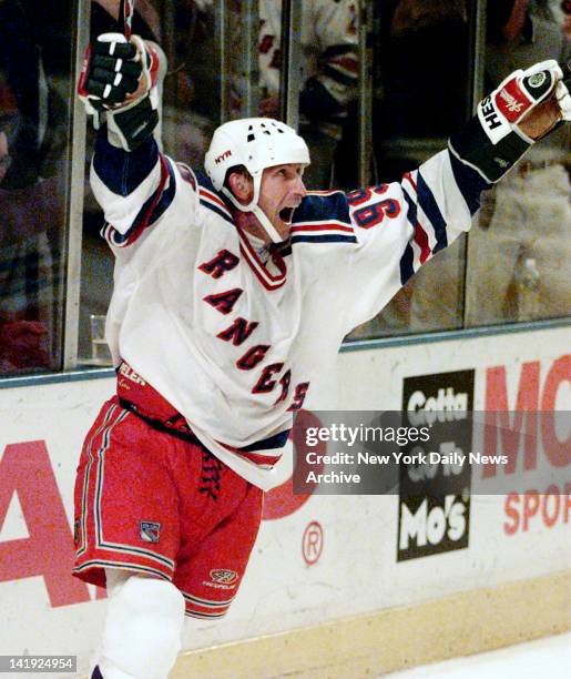 Wayne Gretzky of the New York Rangers celebrates his 1,072nd goal which broke Gordie Howe's all-time goal scoring record in the NHL against the New...