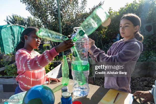 group of school children making environmental art with their teacher - mockup identity stock pictures, royalty-free photos & images