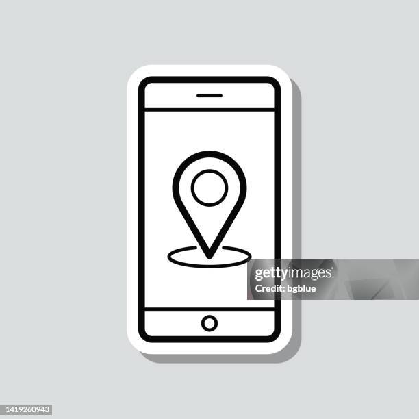 smartphone with location pin. icon sticker on gray background - putting label stock illustrations