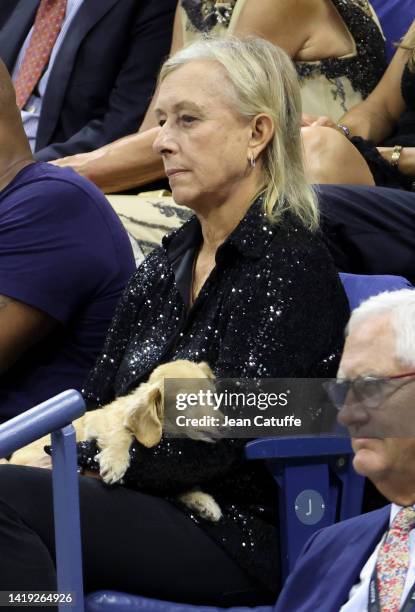 Martina Navratilova holding her dog attends the victory of Serena Williams of USA on Day 1 of the US Open 2022, 4th Grand Slam of the season, at the...