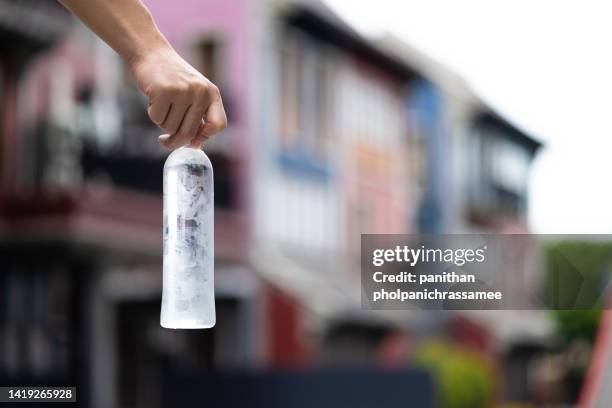 close up  water clear pet bottle with blurred background. - holding bottle stock pictures, royalty-free photos & images