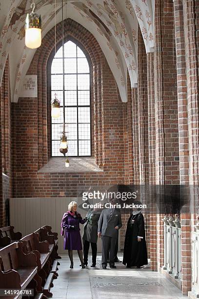 Camilla, Duchess of Cornwall and Prince Charles, Prince of Wales visits St Mary's Church during a tour of the old town on March 26, 2012 in Elsinore,...