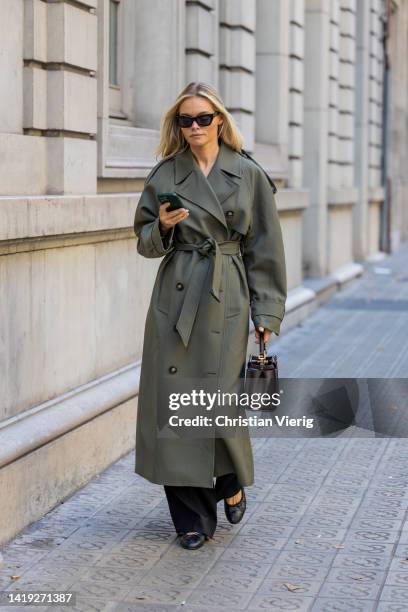 Claire Rose Cliteur wears olive green coat Camilla and Marc, trousers Cos, shoes Chanel bag Fendi, sunglasses Aperçu on August 29, 2022 in Barcelona,...