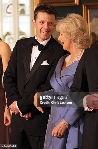 Crown Prince Frederik of Denmark chats to Camilla, Duchess of Cornwall in a receiving line ahead of an official dinner at the Royal Palace on March...