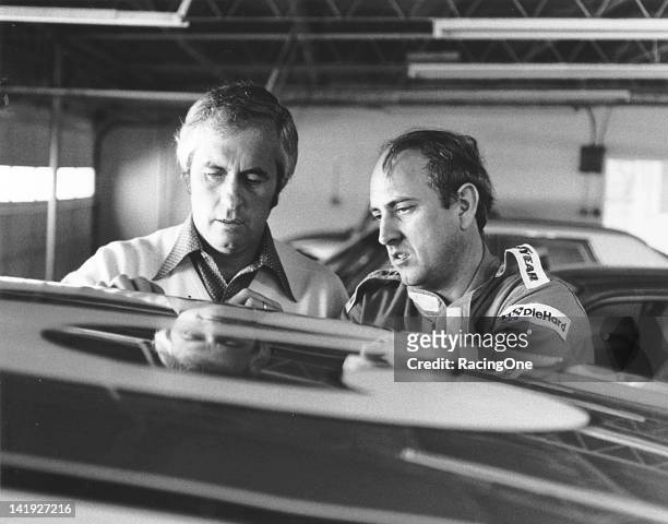 Early-1970s: Roger Penske talks with his driver Dave Marcis at a NASCAR Cup race. Marcis drove 16 Cup events in Penske’s AMC Matador between 1972 and...